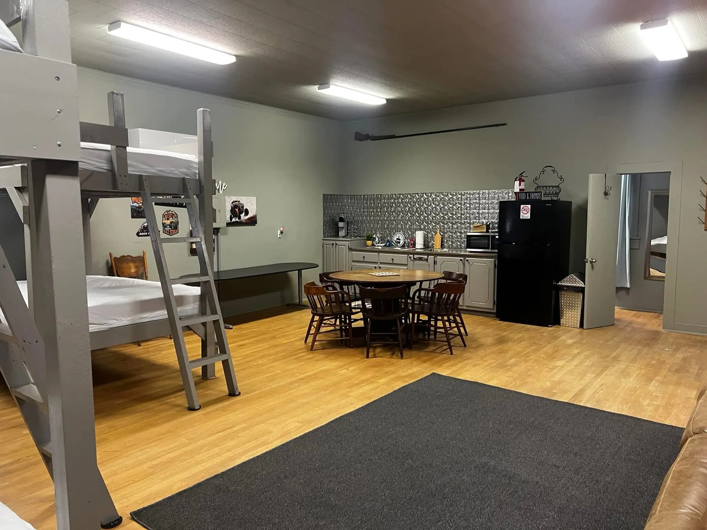 The Bunkhouse's kitchenette with a full fridge, microwave, and coffee pot
