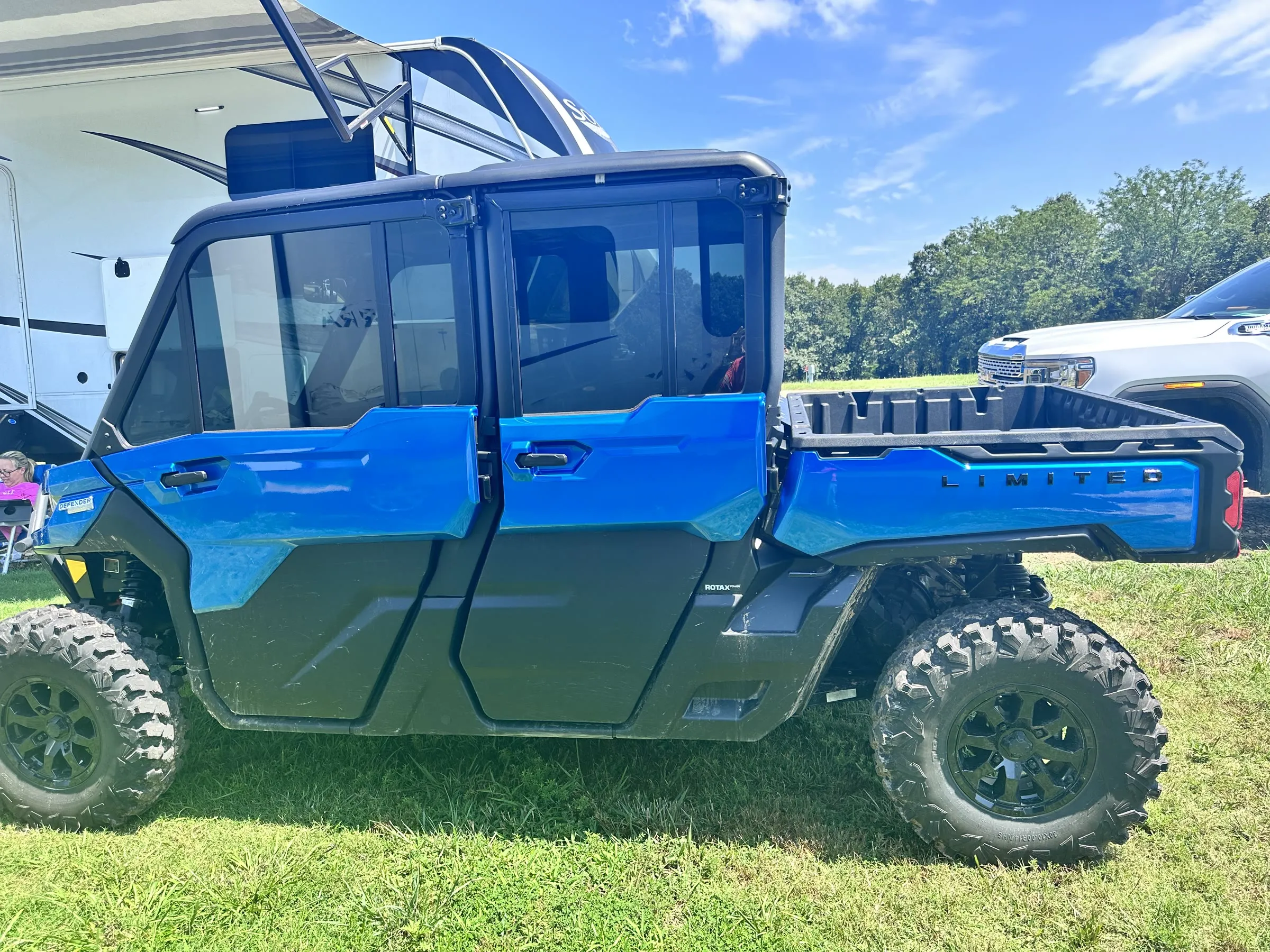 A UTV parked next to an RV at a Shultz Creek campsite